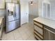 Kitchen featuring stainless steel appliances, white cabinets and a view into the back sunroom at 10101 N 91St Ave # 162, Peoria, AZ 85345