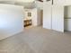 Bright main bedroom featuring neutral carpet, ensuite bathroom, and ample closet space at 10101 N 91St Ave # 162, Peoria, AZ 85345