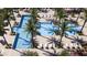 Aerial view of the community pool featuring palm trees, lounge chairs and inviting blue water at 10152 E Ursula Ave, Mesa, AZ 85212