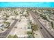 Aerial community view showcasing a neighborhood near a lake at 11317 W Cottonwood Ln, Avondale, AZ 85392