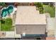 Aerial view of a private backyard with a kidney-shaped pool and well-maintained landscape at 11317 W Cottonwood Ln, Avondale, AZ 85392