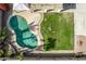 Aerial shot of a backyard with a private pool, lush landscaping, and a built-in firepit at 11317 W Cottonwood Ln, Avondale, AZ 85392