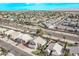 Aerial community view showcasing a neighborhood near a lake at 11317 W Cottonwood Ln, Avondale, AZ 85392