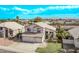 Charming two-story home boasts a three-car garage, landscaped yard, and a well-maintained lawn at 11317 W Cottonwood Ln, Avondale, AZ 85392