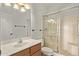 Cozy bathroom featuring a vanity and tub/shower combo with a glass door at 11317 W Cottonwood Ln, Avondale, AZ 85392