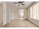 Spacious bedroom with ceiling fan, ensuite bathroom and walk-in closet at 11317 W Cottonwood Ln, Avondale, AZ 85392