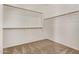 Walk-in closet with built in shelving and neutral carpeting at 11317 W Cottonwood Ln, Avondale, AZ 85392
