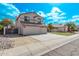 Charming two-story home featuring a three car garage, neutral color palette, and well-maintained landscaping at 11317 W Cottonwood Ln, Avondale, AZ 85392