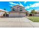 Charming two-story home with a spacious three-car garage and manicured front yard at 11317 W Cottonwood Ln, Avondale, AZ 85392