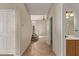Hallway leading to a staircase and other rooms at 11317 W Cottonwood Ln, Avondale, AZ 85392