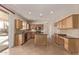 Beautiful kitchen showcasing custom cabinets, granite counters, tile backsplash, island and stainless steel appliances at 11317 W Cottonwood Ln, Avondale, AZ 85392
