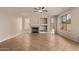 Open living room with tile flooring, fireplace, recessed lighting and large windows offer bright, natural light at 11317 W Cottonwood Ln, Avondale, AZ 85392