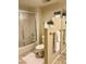 Bathroom with a toilet, a glass-enclosed shower, and tiled floors at 12222 N Paradise Village Pkwy # 321, Phoenix, AZ 85032