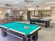 Large game room with billiards table, bar, kitchenette, and ping pong table at 12222 N Paradise Village Pkwy # 321, Phoenix, AZ 85032