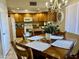 A kitchen and dining area featuring wood table set, bright lighting, and white appliances at 12222 N Paradise Village Pkwy # 321, Phoenix, AZ 85032
