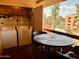 Outdoor patio with a washer and dryer, wicker furniture, and a view of the buildings and pool at 12222 N Paradise Village Pkwy # 321, Phoenix, AZ 85032