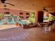 Outdoor patio with table and chairs overlooking a community pool with a waterfall feature at 12222 N Paradise Village Pkwy # 321, Phoenix, AZ 85032