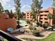 Community swimming pool with waterfall features and lounge chairs at 12222 N Paradise Village Pkwy # 321, Phoenix, AZ 85032