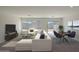 A modern living area features stylish furniture, decor, large windows and a sliding glass door at 1304 W Inca Dr, Coolidge, AZ 85128