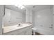 Well-lit bathroom featuring a vanity with ample storage, a shower, and a tub combination at 13811 N 42Nd Pl, Phoenix, AZ 85032