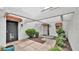 Inviting entryway with stylish accents, desert landscaping, and a sheltered walkway at 13811 N 42Nd Pl, Phoenix, AZ 85032