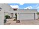 Charming home with a spacious two-car garage, desert landscaping, and striking curb appeal at 13811 N 42Nd Pl, Phoenix, AZ 85032