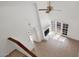 Sun-lit living room includes a fireplace, ceiling fan and sliding glass doors at 13811 N 42Nd Pl, Phoenix, AZ 85032
