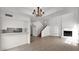 Inviting living room flows into dining space and features a fireplace at 13811 N 42Nd Pl, Phoenix, AZ 85032