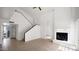 Cozy living room with fireplace and staircase to the upper level at 13811 N 42Nd Pl, Phoenix, AZ 85032