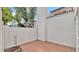 Enclosed patio space with brick flooring and a brick wall at 13811 N 42Nd Pl, Phoenix, AZ 85032