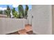 Enclosed patio space with brick flooring and a brick wall at 13811 N 42Nd Pl, Phoenix, AZ 85032