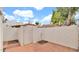 Enclosed patio space with brick flooring and a brick wall at 13811 N 42Nd Pl, Phoenix, AZ 85032