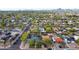 Expansive aerial view of a suburban neighborhood with tree-lined streets and mountain views at 1402 E Granada Rd, Phoenix, AZ 85006