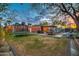 Spacious backyard with grassy area, trampoline, and covered outdoor living space at 1402 E Granada Rd, Phoenix, AZ 85006