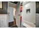 Bright bathroom features a tub, a shower, and a unique built in shelving at 1402 E Granada Rd, Phoenix, AZ 85006