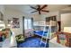 Bright bedroom features a bunk bed, a ceiling fan, and a large area rug at 1402 E Granada Rd, Phoenix, AZ 85006