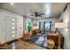Bright and airy living room with stylish furniture, a modern ceiling fan, and open layout flowing into the dining area at 1402 E Granada Rd, Phoenix, AZ 85006