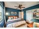 Cozy main bedroom featuring a comfortable bed, modern decor, and a ceiling fan at 1402 E Granada Rd, Phoenix, AZ 85006