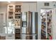 View of pantry through doorway with floor to ceiling storage shelves at 1402 E Granada Rd, Phoenix, AZ 85006