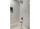 Bright bathroom features a tub, a shower with modern fixtures, and subway tile at 1402 E Granada Rd, Phoenix, AZ 85006