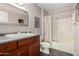Bathroom with a shower-tub combo and cherry wood vanity at 1440 N Idaho Rd # 2053, Apache Junction, AZ 85119