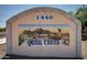 Community sign featuring desert-themed artwork with quail set against a picturesque desert landscape at 1440 N Idaho Rd # 2053, Apache Junction, AZ 85119