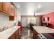 Open kitchen and living space features granite countertops, tile flooring, and stainless appliances at 1440 N Idaho Rd # 2053, Apache Junction, AZ 85119