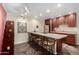 Contemporary kitchen with bar stool seating, modern lighting, and stainless appliances at 1440 N Idaho Rd # 2053, Apache Junction, AZ 85119