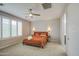 Bright primary bedroom featuring a ceiling fan, neutral paint, and lots of natural light at 14413 W Dahlia Dr, Surprise, AZ 85379