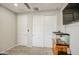 Bedroom featuring white sliding door closet, ceiling fan, and fish tank at 14413 W Dahlia Dr, Surprise, AZ 85379