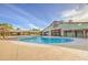 Large community pool is complete with bathhouse, pergola, and lush landscaping at 14413 W Dahlia Dr, Surprise, AZ 85379