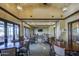 Warm and welcoming dining area with ample seating, ideal for shared meals and creating a sense of community at 14413 W Dahlia Dr, Surprise, AZ 85379