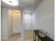Bright entryway with hard surface floors and a white front door at 14413 W Dahlia Dr, Surprise, AZ 85379