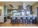 Well-equipped kitchen featuring stainless steel appliances, generous counter space, and bar seating for a modern, functional layout at 14413 W Dahlia Dr, Surprise, AZ 85379